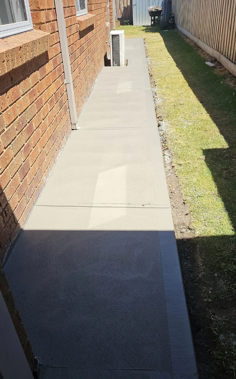 Concrete side path along a house
