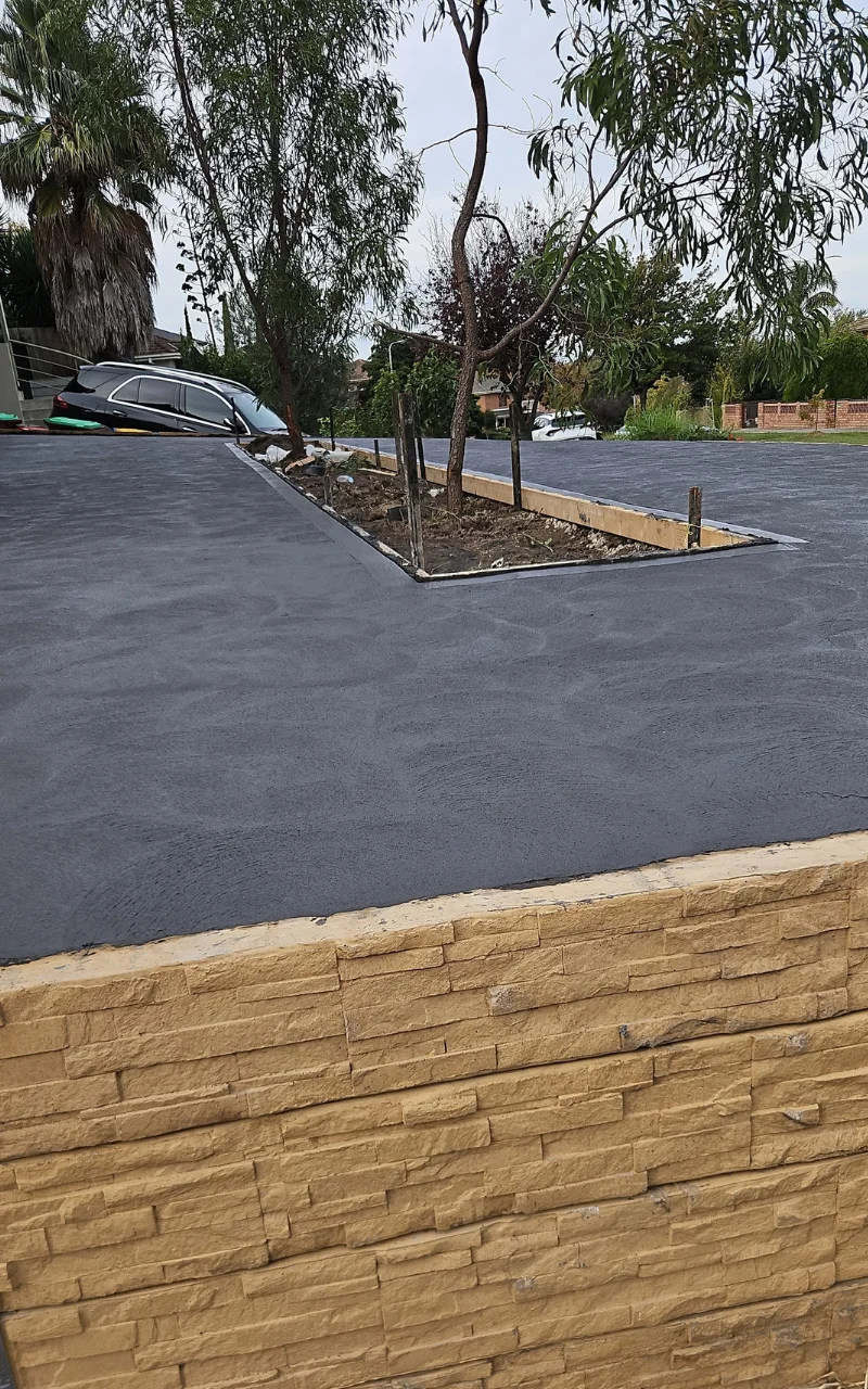 The AZ Concreting team working on a retaining wall & concreting project in a residential site in Southeast Melbourne